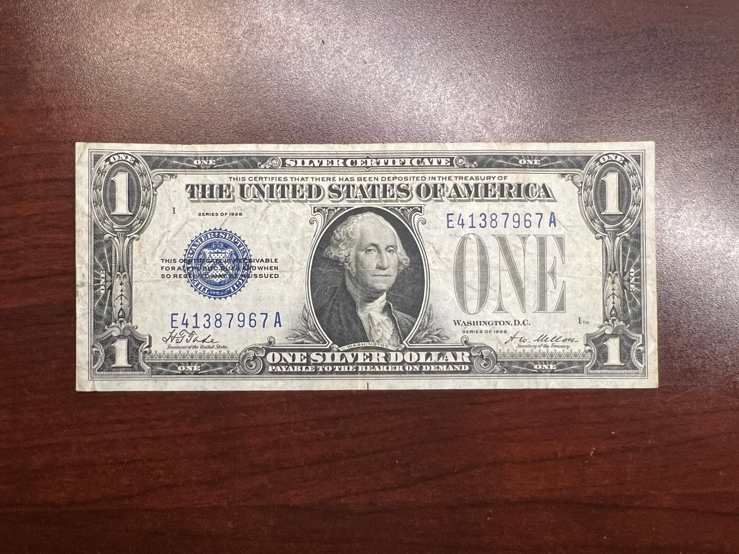 1928 $1 Silver Certificate – “Funny Back” – VF+ Good Color – No Tears/Pinholes – Sealed in Premium BCW Hard Display Case-7967
